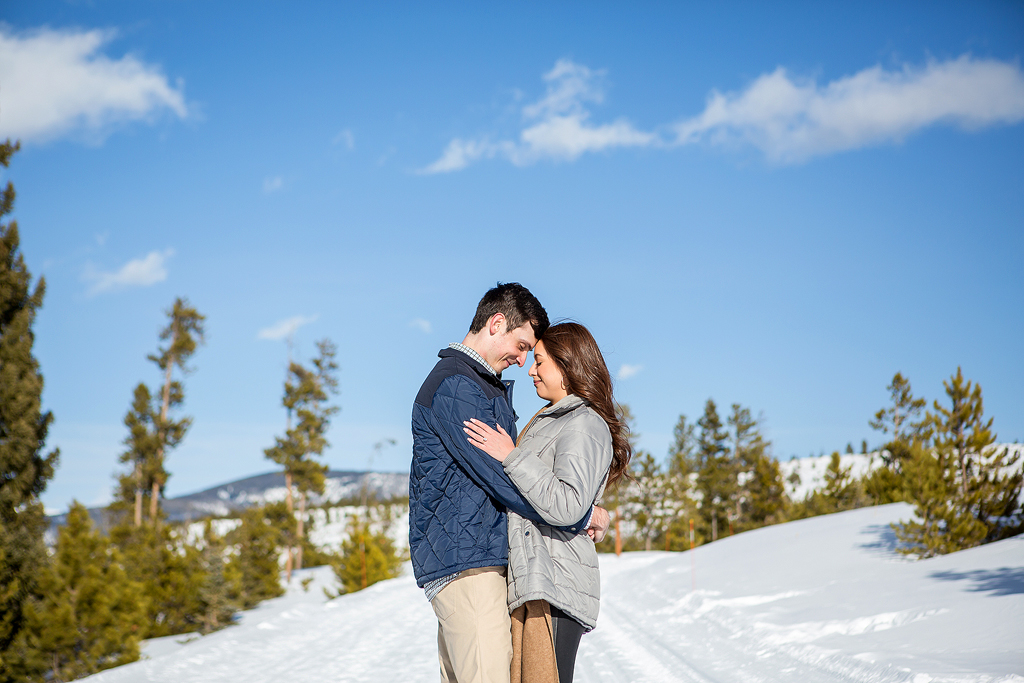 Scott and Stephanie leaning their heads together and taking a quiet moment after the surprise proposal.