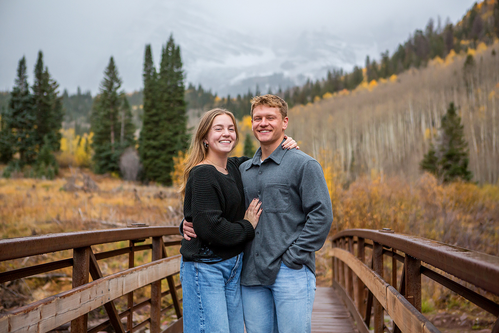 Jackson and Claire on a bridge at Maroon Bells near Aspen after their surprise proposal.