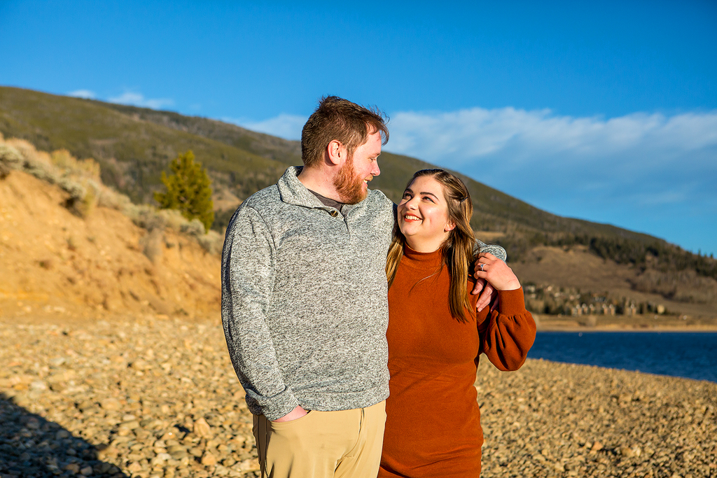 Greg and Rachel walking together after their Colorado surprise proposal in Dillon.
