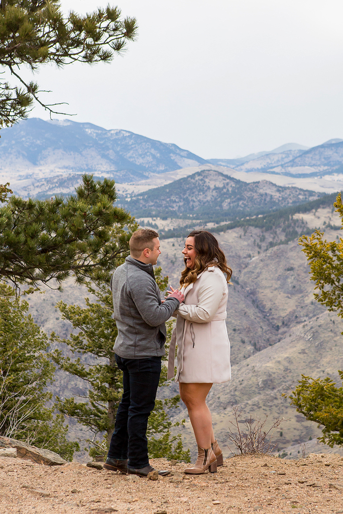 Marissa shouts in excitement after Garrett proposes in the Foothills of Colorado.