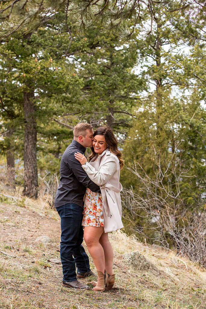 Garrett and Marissa in a pine forest at Lookout Mountain, in Colorado.