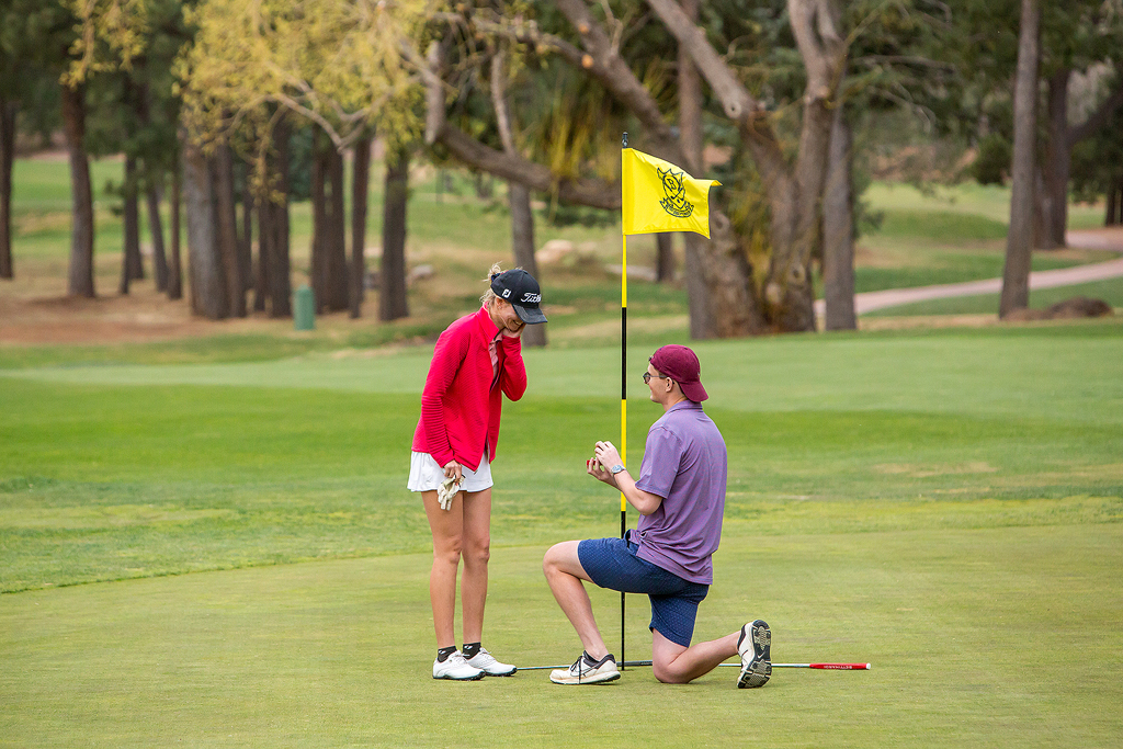 Morgan puts her hands to her face in disbelief as Matt kneels with an engagement ring.
