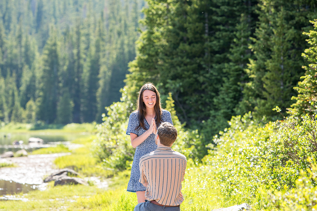 Madeline's joyful reaction as Matt proposes at Brainard Lake near the city of Boulder.