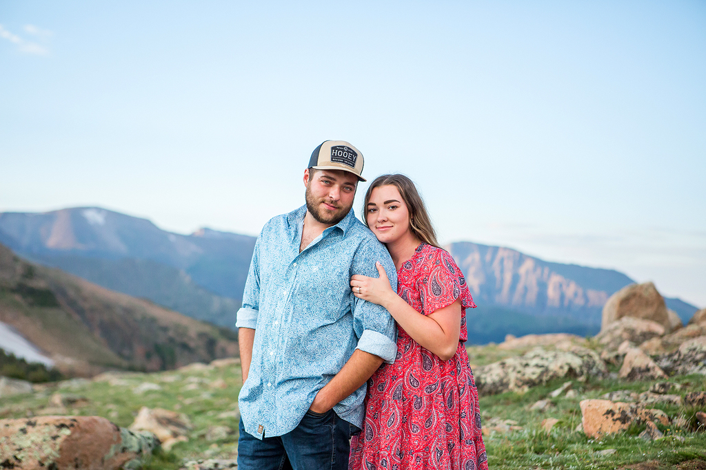 Sabrina hugs onto Zach's arm in the alpine tundra in RMNP.